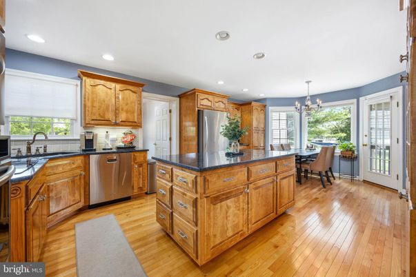 Chandelier, Dining room, Interior, Kitchen, Recessed Lighting, Stainless Steel Appliances, Wood Texture Flooring