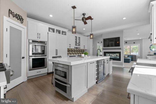 Fireplace, Interior, Kitchen, Pendant Lights, Recessed Lighting, Stainless Steel Appliances, Wood Texture Flooring