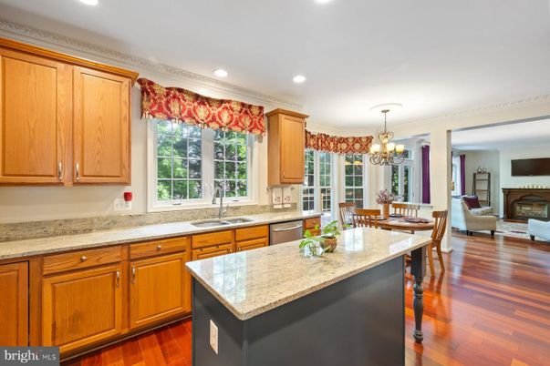 Chandelier, Dining room, Fireplace, Interior, Kitchen, Living room, Recessed Lighting, Wood Texture Flooring