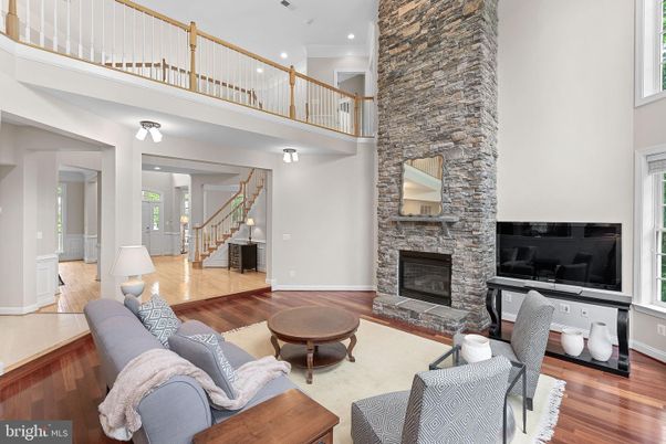 Fireplace, Interior, Living room, Recessed Lighting, Stone Walls, Wood Texture Flooring