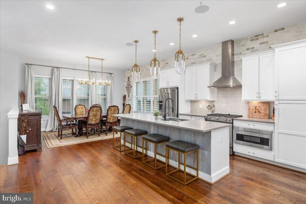 Dining room, Interior, Kitchen, Pendant Lights, Recessed Lighting, Stainless Steel Appliances, Stone Walls, Wood Texture Flooring