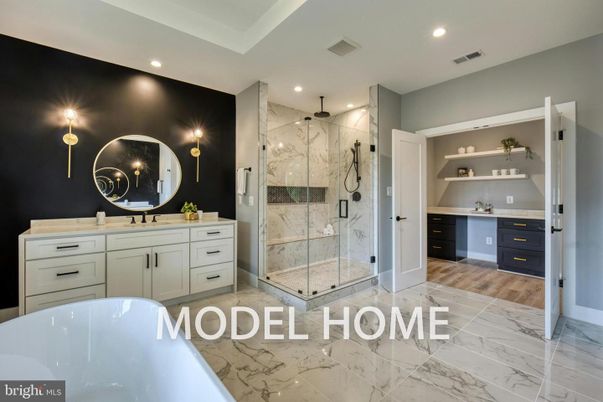 Bathroom, Dual Sink Vanities, Free Standing Baths, Glass Shower, Interior, Marble, Marble Walls, Recessed Lighting, Wood Texture Flooring