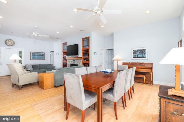 Dining room, Fireplace, Interior, Living room, Piano, Recessed Lighting, Wood Texture Flooring