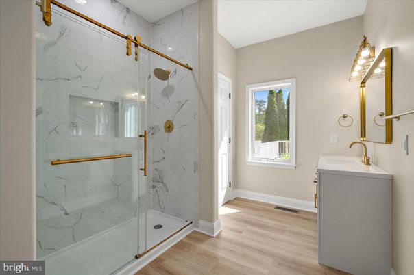 Bathroom, Glass Shower, Interior, Marble Walls, Wood Texture Flooring