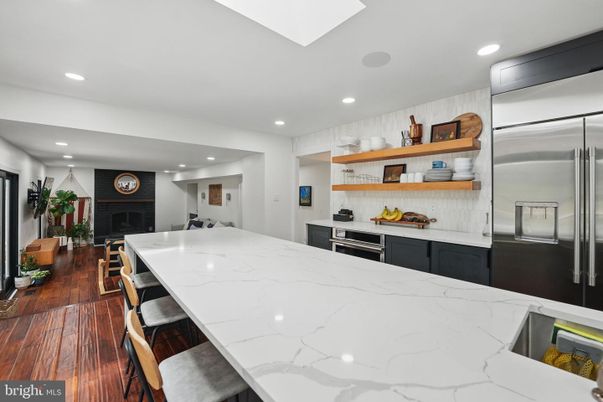 Fireplace, Interior, Kitchen, Recessed Lighting, Stainless Steel Appliances, Wood Texture Flooring
