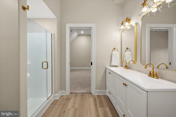Bathroom, Dual Sink Vanities, Glass Shower, Interior, Recessed Lighting, Wood Texture Flooring