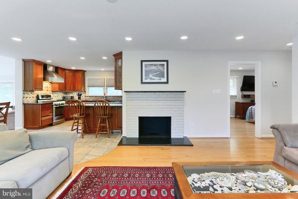 Fireplace, Interior, Kitchen, Recessed Lighting, Stainless Steel Appliances, Wood Texture Flooring