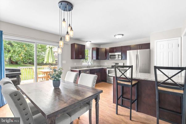 Dining room, Interior, Kitchen, Pendant Lights, Stainless Steel Appliances, Wood Texture Flooring