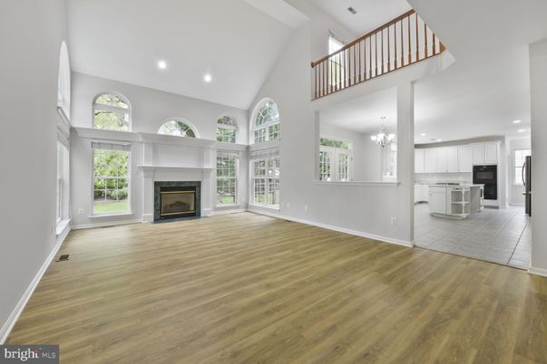 Chandelier, Fireplace, Interior, Kitchen, Recessed Lighting, Wood Texture Flooring