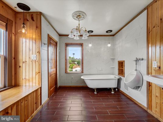 Bathroom, Chandelier, Free Standing Baths, Interior, Pendant Lights, Wood Texture Flooring, Wooden Walls