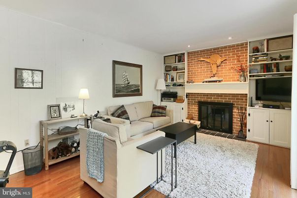Fireplace, Interior, Living room, Recessed Lighting, Stone Walls, Wood Texture Flooring