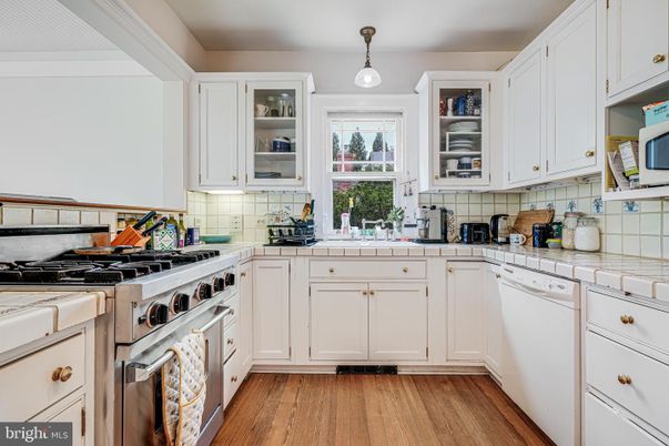 Interior, Kitchen, Pendant Lights, Tile Countertops, Wood Texture Flooring