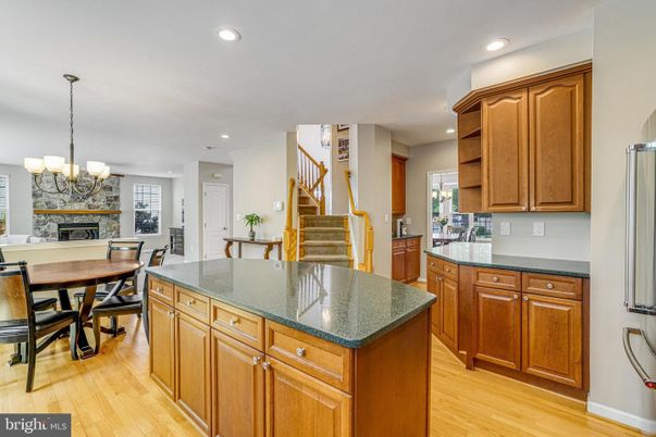 Chandelier, Dining room, Fireplace, Interior, Kitchen, Recessed Lighting, Wood Texture Flooring