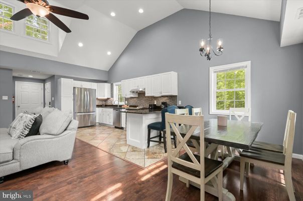 Chandelier, Dining room, Interior, Kitchen, Pendant Lights, Recessed Lighting, Stainless Steel Appliances, Wood Texture Flooring