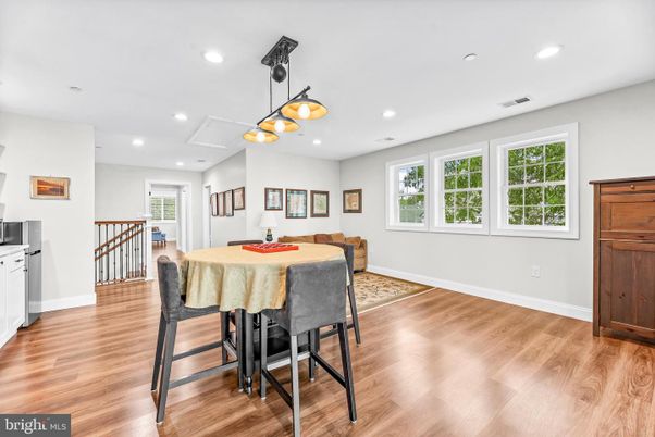 Dining room, Game Room, Interior, Pendant Lights, Recessed Lighting, Wood Texture Flooring