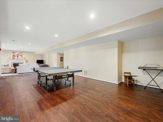 Fireplace, Game Room, Interior, Recessed Lighting, Wood Texture Flooring