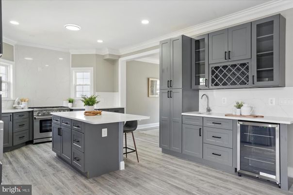 Interior, Kitchen, Marble Walls, Recessed Lighting, Stainless Steel Appliances, Wood Texture Flooring