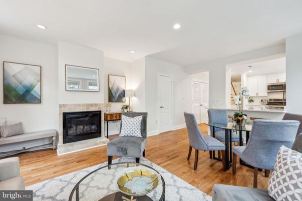 Dining room, Fireplace, Interior, Kitchen, Recessed Lighting, Stainless Steel Appliances, Wood Texture Flooring