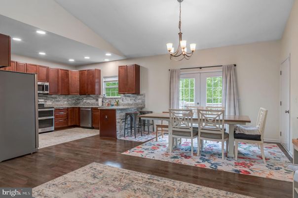 Chandelier, Dining room, Interior, Kitchen, Recessed Lighting, Stainless Steel Appliances, Wood Texture Flooring
