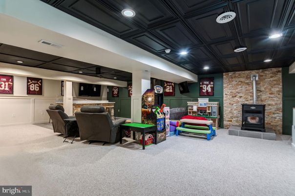 Fireplace, Game Room, Interior, Recessed Lighting, Stone Walls