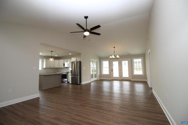 Chandelier, Empty room, Interior, Kitchen, Pendant Lights, Recessed Lighting, Stainless Steel Appliances, Wood Texture Flooring