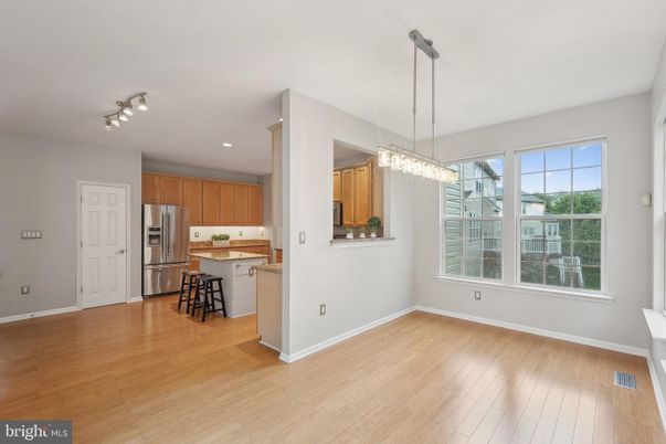 Chandelier, Interior, Kitchen, Pendant Lights, Recessed Lighting, Stainless Steel Appliances, Wood Texture Flooring