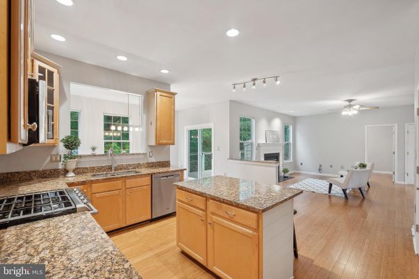 Dining room, Fireplace, Interior, Kitchen, Recessed Lighting, Wood Texture Flooring