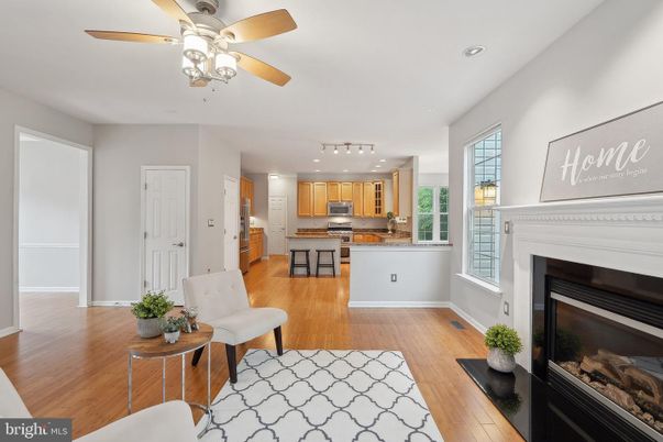 Fireplace, Interior, Kitchen, Recessed Lighting, Stainless Steel Appliances, Wood Texture Flooring