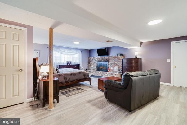 Bedroom, Fireplace, Interior, Recessed Lighting, Wood Texture Flooring