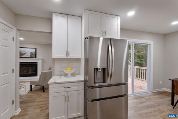 Fireplace, Interior, Kitchen, Recessed Lighting, Stainless Steel Appliances, Wood Texture Flooring