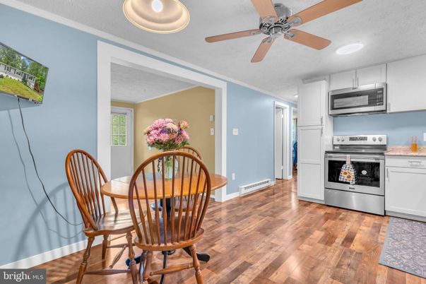 Dining room, Interior, Kitchen, Recessed Lighting, Stainless Steel Appliances, Wood Texture Flooring