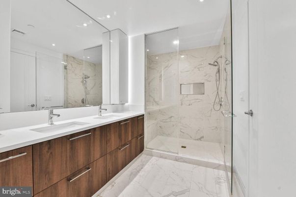 Bathroom, Dual Sink Vanities, Glass Shower, Interior, Marble, Marble Walls, Recessed Lighting