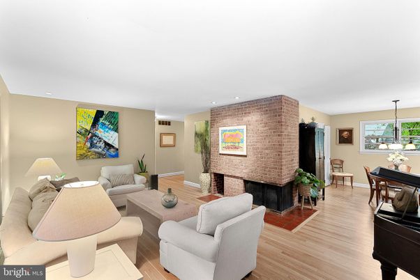 Dining room, Fireplace, Interior, Living room, Piano, Recessed Lighting, Stone Walls, Wood Texture Flooring