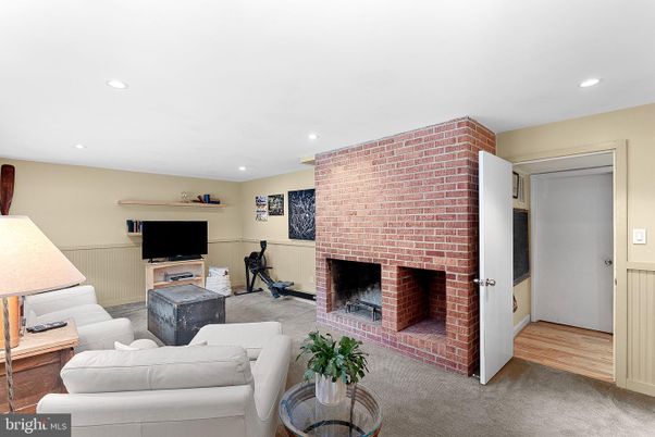 Fireplace, Interior, Living room, Recessed Lighting, Stone Walls, Wood Texture Flooring