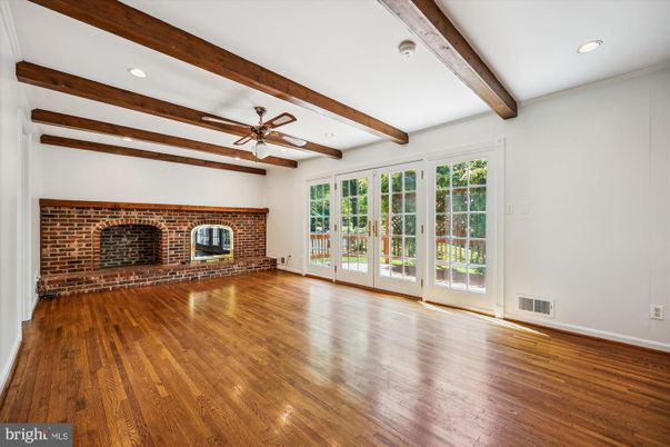 Empty room, Fireplace, Interior, Recessed Lighting, Stone Walls, Wooden Beams, Wood Texture Flooring