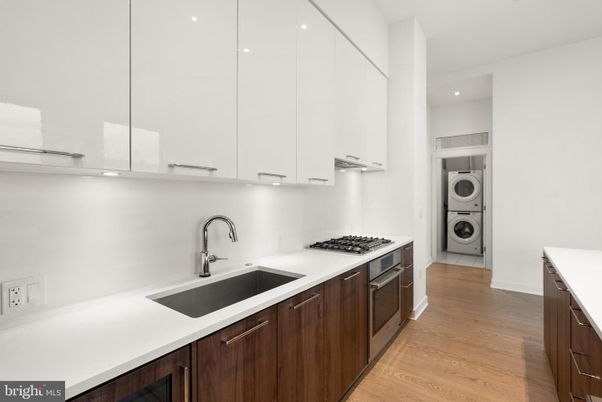 Interior, Kitchen, Recessed Lighting, Washer, Wood Texture Flooring
