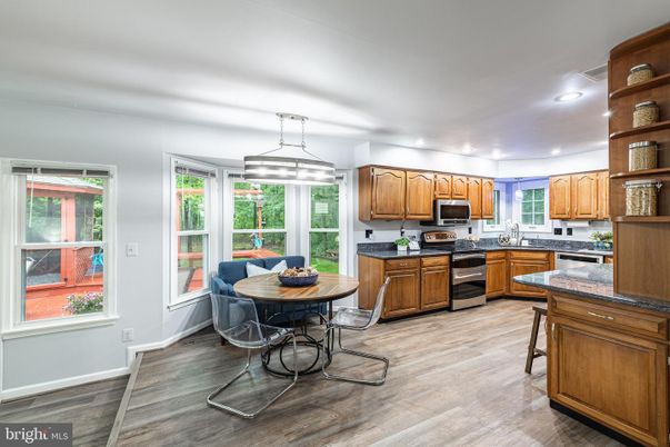 Dining room, Interior, Kitchen, Pendant Lights, Recessed Lighting, Stainless Steel Appliances, Wood Texture Flooring