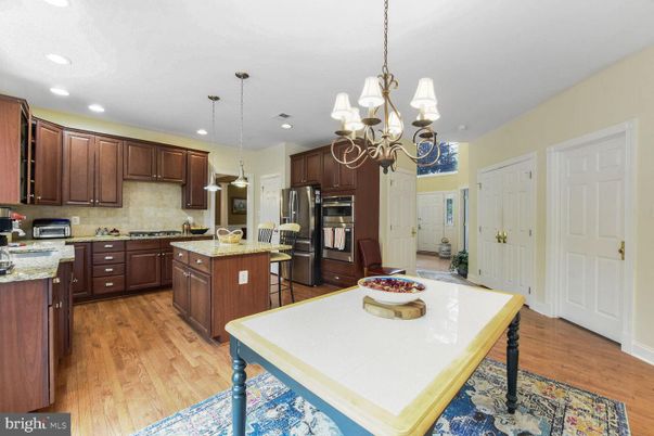 Chandelier, Interior, Kitchen, Pendant Lights, Recessed Lighting, Stainless Steel Appliances, Wood Texture Flooring