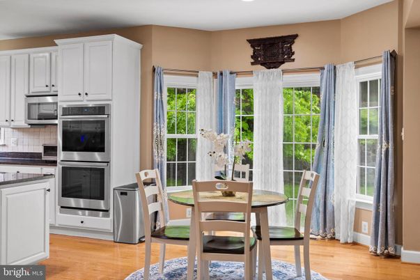 Dining room, Interior, Kitchen, Recessed Lighting, Stainless Steel Appliances, Wood Texture Flooring