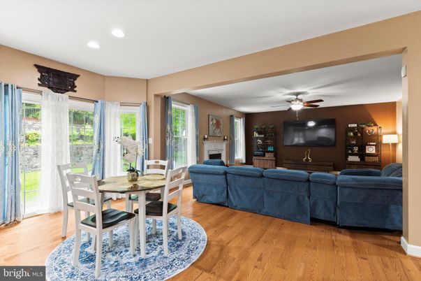Dining room, Fireplace, Interior, Living room, Recessed Lighting, Wood Texture Flooring