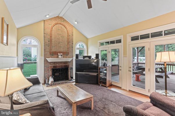 Fireplace, Interior, Living room, Recessed Lighting, Stone Walls, Wood Texture Flooring