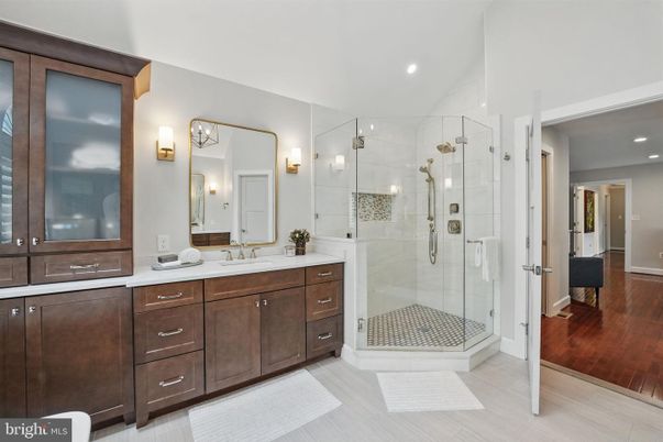 Bathroom, Dual Sink Vanities, Glass Shower, Interior, Recessed Lighting, Wood Texture Flooring