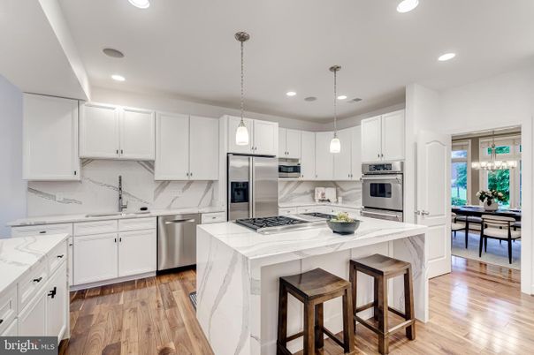 Dining room, Interior, Kitchen, Pendant Lights, Recessed Lighting, Stainless Steel Appliances, Wood Texture Flooring