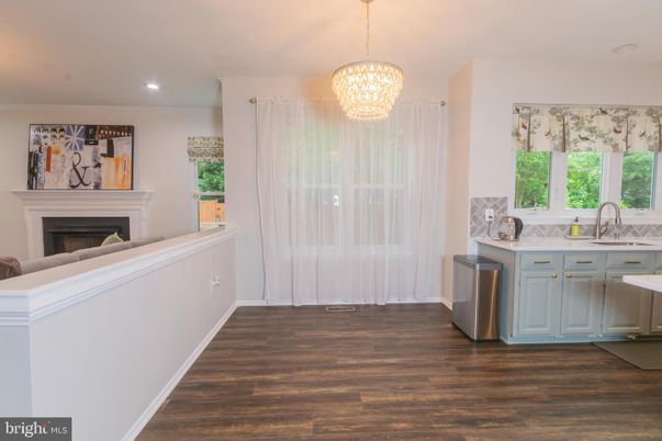 Chandelier, Fireplace, Interior, Kitchen, Recessed Lighting, Wood Texture Flooring