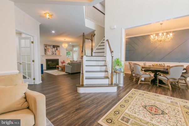 Chandelier, Dining room, Fireplace, Interior, Living room, Recessed Lighting, Wood Texture Flooring