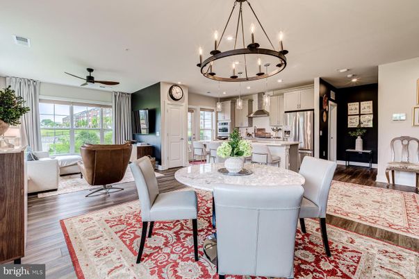Chandelier, Dining room, Interior, Kitchen, Living room, Pendant Lights, Recessed Lighting, Stainless Steel Appliances, Wood Texture Flooring
