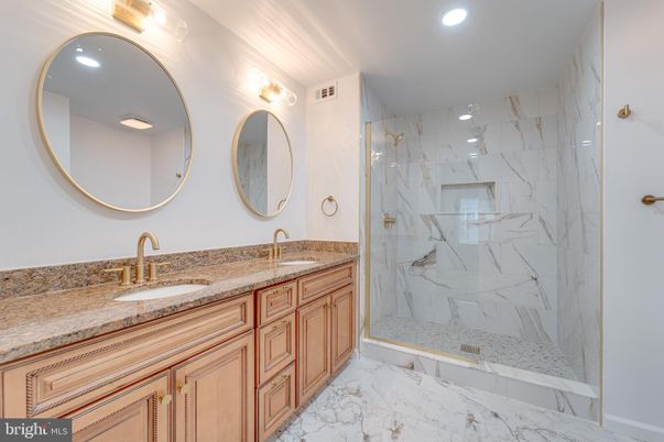 Bathroom, Dual Sink Vanities, Glass Shower, Interior, Marble, Marble Walls, Recessed Lighting