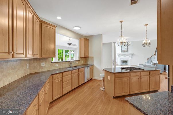 Chandelier, Fireplace, Interior, Kitchen, Recessed Lighting, Wood Texture Flooring
