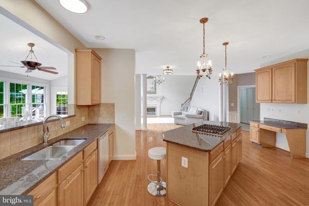 Chandelier, Fireplace, Interior, Kitchen, Living room, Pendant Lights, Recessed Lighting, Wood Texture Flooring