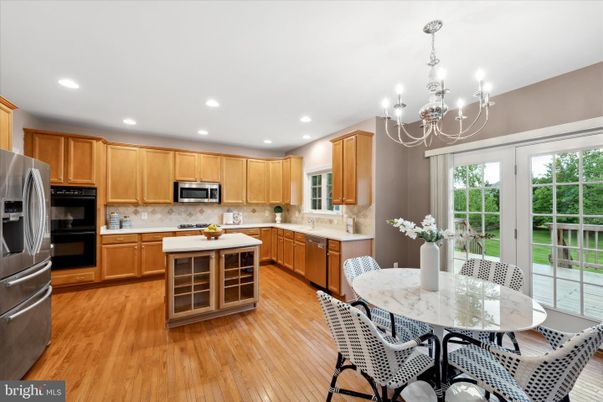 Chandelier, Dining room, Interior, Kitchen, Recessed Lighting, Stainless Steel Appliances, Wood Texture Flooring